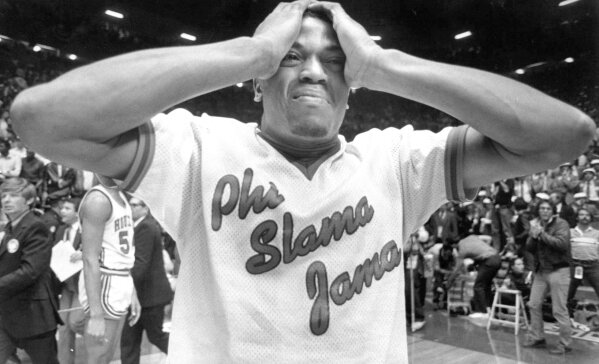 FILE - In this April 4, 1983, file photo, Houston's Renaldo Thomas holds his head after losing 54-52 to North Carolina State in the championship game of the NCAA college basketball championship game in Albuquerque, N.M. (Larry Reese/Houston Chronicle via AP, File)