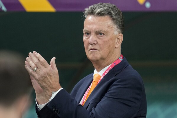 FILE - Then head coach Louis van Gaal of the Netherlands applauds prior to the start of the World Cup group A soccer match between Netherlands and Ecuador in Doha, Qatar, Friday, Nov. 25, 2022. Veteran coach Louis van Gaal is coming out of retirement to help get Dutch power Ajax get back on track after one if its worst season starts in decades. The Amsterdam club, a four-time European champion, announced late Tuesday that 72-year-old Van Gaal will advise the Ajax Supervisory Board “on football technical matters.” (AP Photo/Natacha Pisarenko, File)