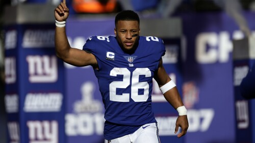 FILE - New York Giants running back Saquon Barkley is introduced before an NFL football game against the Indianapolis Colts, Jan. 1, 2023, in East Rutherford, N.J. Barkley and the Giants failed to reach an agreement on a long-term contract extension by the Monday, July 17, 2023, deadline for franchised players, leaving the star running back with the option of playing for the tag-mandated $10.1 million salary or maybe taking the season off. (AP Photo/Adam Hunger, File)