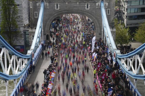 Runners cross Tower Bridge during the London Marathon, London, Sunday April 21, 2024. (Aaron Chown/PA via AP)