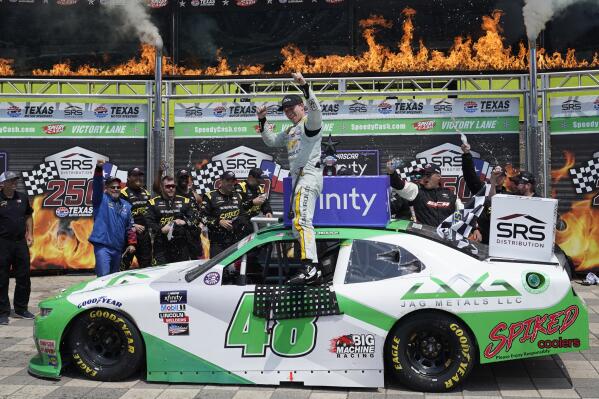 Tyler Reddick (48) celebrate in Victory Lane after winning the NASCAR Xfinity Series auto race at Texas Motor Speedway in Fort Worth, Texas, Saturday, May 21, 2022. (AP Photo/LM Otero)