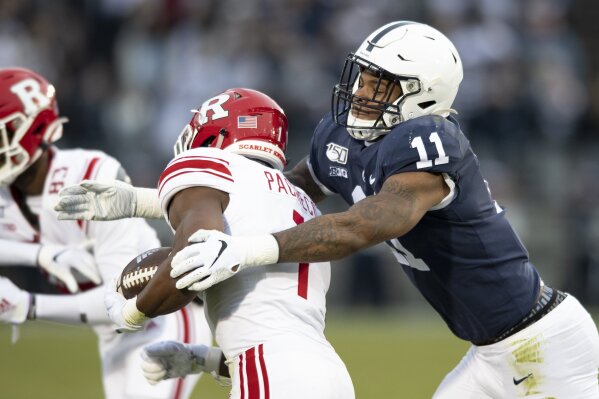 FILE - In this Nov. 30, 2019, file photo, Penn State linebacker Micah Parsons (11) tackles Rutgers tight end Johnathan Lewis (11) in the first quarter of an NCAA college football game, in State College, Pa. Penn State All-American Micah Parsons is opting out of the 2020 season because of concerns about COVID-19. The junior linebacker made his announcement with a social media post Thursday, Aug. 6, 2020. (AP Photo/Barry Reeger, File)