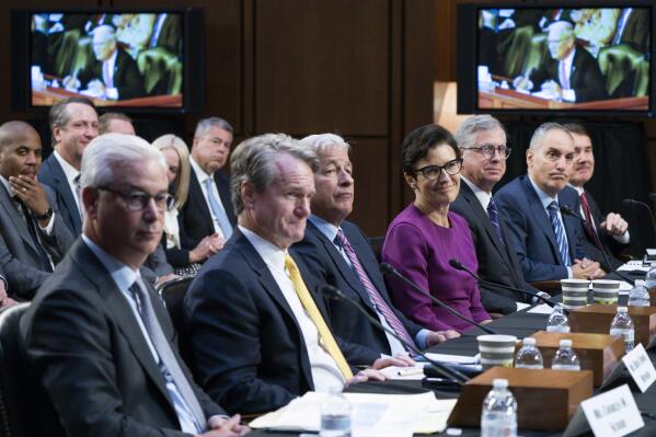 From left, Wells Fargo & Company CEO and President Charles Scharf, Bank of America Chairman and CEO Brian Thomas Moynihan, JPMorgan Chase & Company Chairman and CEO Jamie Dimon, Citigroup CEO Jane Fraser, Truist Financial Corporation Chairman and CEO William Rogers Jr., U.S. Bancorp Chairman, President, and CEO Andy Cecere, and The PNC Financial Services Group Chairman, President, and CEO William Demchak, attend a Senate Banking Committee annual Wall Street oversight hearing, Thursday, Sept. 22, 2022, on Capitol Hill in Washington. (AP Photo/Jacquelyn Martin)