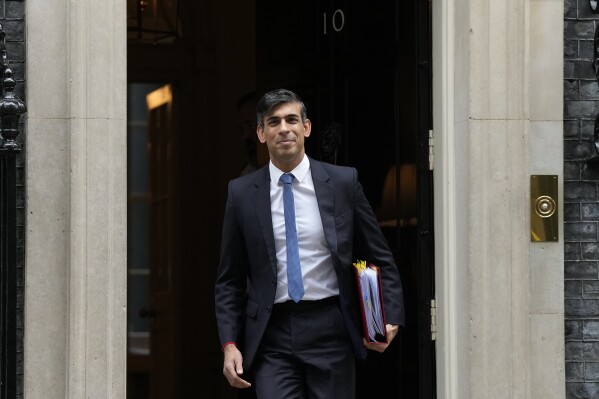 Britain's Prime Minister Rishi Sunak leaves 10 Downing Street for his weekly Prime Ministers Questions at the House of Commons in London, Wednesday, Nov. 22, 2023. (AP Photo/Frank Augstein)