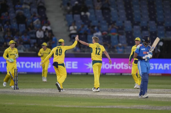 Australia's Nathan Ellis celebrates the dismissal of India's Axar Patel during the ICC Champions Trophy semifinal cricket match between India and Australia at Dubai International Cricket Stadium in Dubai, United Arab Emirates, Tuesday, March 4, 2025. (AP Photo/Altaf Qadri)