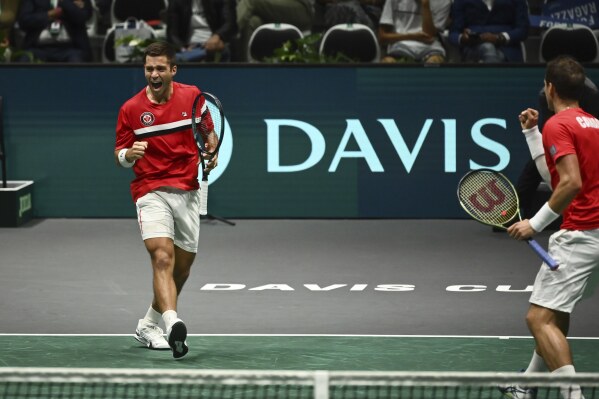 Canada's Alexis Galarneau and Vasek Pospisil in action against Italy's Simone Bolelli and Matteo Arnaldi during the Davis Cup group stage tennis match at the Unipol Arena, Bologna, Italy, Wednesday, Sept. 13. 2023. (Massimo Paolone/PA via AP)