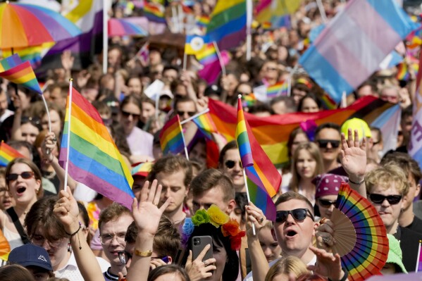 People take part in Poland's yearly Pride parade, known as the Equality Parade, in Warsaw, Poland, on Saturday June 17, 2023. (AP Photo/Czarek Sokolowski)