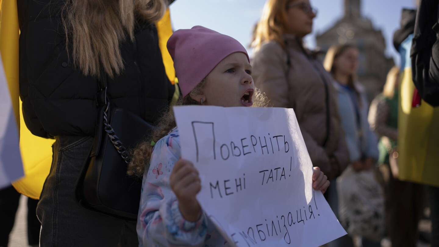 War-weary mothers, wives and children of Ukrainian soldiers demand a cap on military service time