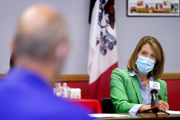 In this Sept. 2, 2021, photo Rep. Cindy Axne, D-Iowa, speaks about the Rural Reinvestment Task Force during a meeting with local officials in Indianola, Iowa. (AP Photo/Charlie Neibergall)