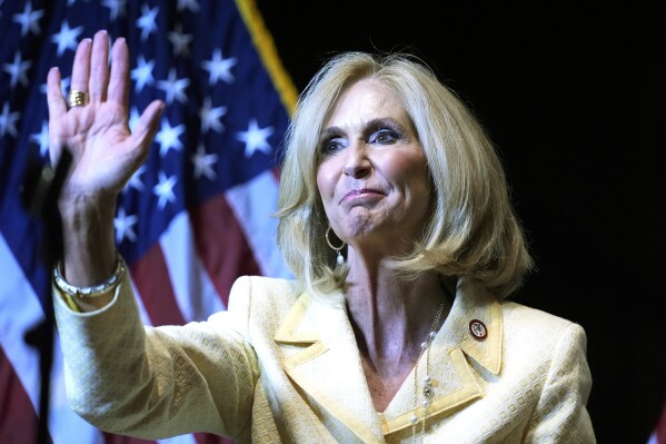 Mississippi Attorney General Lynn Fitch waves to the crowd at a Trump for President rally in Jackson, Miss., Thursday, June 6, 2024. Fitch was named a defendant in a lawsuit filed Friday, June 7, 2024, in federal court over a new Mississippi law requiring users of websites and other digital services to register their age. The suit by the tech industry group NetChoice contends the law will unconstitutionally limit access to online speech for minors and adults. (AP Photo/Rogelio V. Solis)