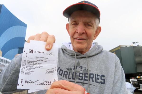 Jim "Mattress Mack" McIngvale, of Houston, holds some of the tickets in Atlantic City N.J., Tuesday, Nov. 1, 2022, showing bets he has made on the Houston Astros to win the baseball World Series. A prolific gambler with a knack for attention-getting bets stands to win nearly $75 million if the Houston Astros win the World Series, including what sports books say would be the largest payout on a single legal sports bet in U.S. history. McIngvale has wagered a total of $10 million with numerous sports books on an Astros victory. (AP Photo/Wayne Parry)