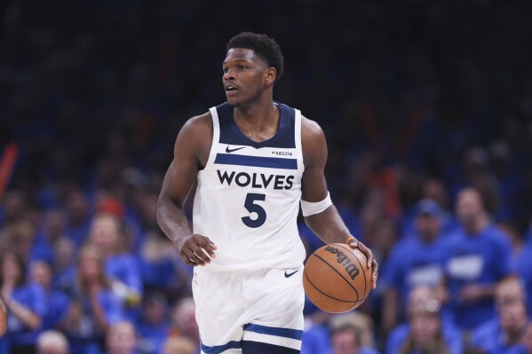 Minnesota Timberwolves guard Anthony Edwards dribbles the ball up court against the Oklahoma City Thunder during the second half of Game 2 of an NBA basketball Western Conference Finals playoff series Thursday, May 22, 2025, in Oklahoma City. (AP Photo/Nate Billings)