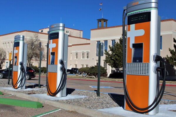 FILE - This Dec. 21, 2020 image provided by the New Mexico General Services Department shows some of the recently installed electric vehicle charging stations at the Bataan Memorial Building in Santa Fe, N.M. Mandates for auto dealers to provide an increasing number of electric vehicles for sale across New Mexico will remain in place as state regulators on Friday, April 5, 2024, denied an effort to derail implementation of the new rules pending a legal challenge. (Thom Cole/New Mexico General Services Department, via AP)