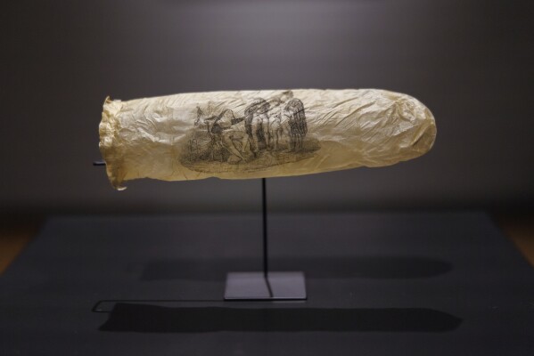 EDS NOTE: NUDITY - This image made available by the Rijksmueum shows a condom with print, circa 1830, which has gone on display at Amsterdam's Rijksmuseum. (Kelly Schenk/Rijksmuseum via AP)