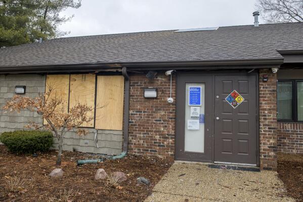 FILE- A front window is boarded up at the Planned Parenthood Health Center at 2709 Knoxville Avenue in Peoria, Ill., on Monday, Jan. 16, 2023. Tyler W. Massengill of Chillicothe, Ill. pleaded guilty Thursday, Feb 16, 2023, to “malicious use of fire” to damage the Planned Parenthood clinic last month, federal law enforcement said. (Matt Dayhoff/Journal Star via AP)