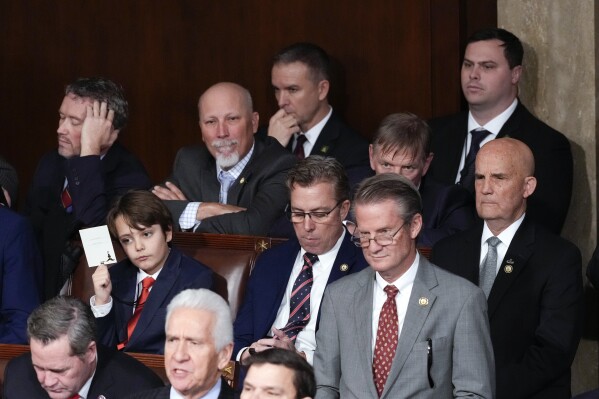 Conservative House members listen as the House of Representatives vote for a House Speaker during the opening of the 119th Congress, at the Capitol in Washington, Friday, Jan. 3, 2025. (AP Photo/J. Scott Applewhite)