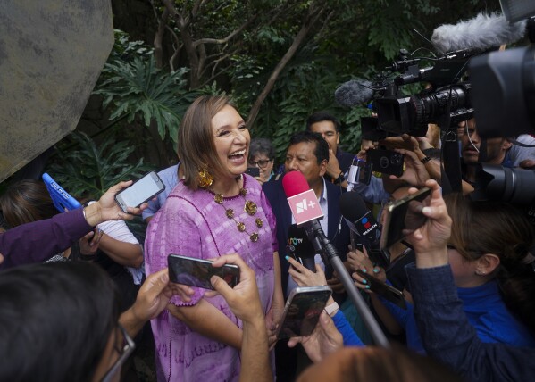 Congresswoman Xochitl Galvez, an opposition presidential hopeful, speaks to the press after registering her name as a candidate, in Mexico City, Tuesday, July 4, 2023. (AP Photo/Fernando Llano)