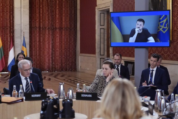 Ukrainian President of Ukraine Volodymyr Zelenskyy listens to Norway's Prime Minister Jonas Gahr Støre, as he joins Europe leaders via video link, during a meeting of the Joint Expeditionary Force (JEF) in Oslo, Friday, May 9, 2025. (Lise Åserud/NTB Scanpix via AP)