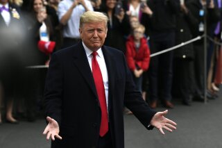 President Donald Trump speaks to the members of the media before leaving the White House, Monday, Jan. 13, 2020, in Washington, for a trip to watch the College Football Playoff national championship game in New Orleans. (AP Photo/Susan Walsh)
