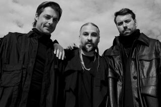 This photo provided by Swedish House Mafia shows Axwell, from left, Steve Angello, and Sebastian Ingrosso of Swedish House Mafia as they pose for a self portrait on Thursday, Oct. 21, 2021 in Stockholm, Sweden.  DJ supergroup Swedish House Mafia are back with a new collab with The Weeknd and a world tour on the horizon. (Swedish House Mafia via AP)