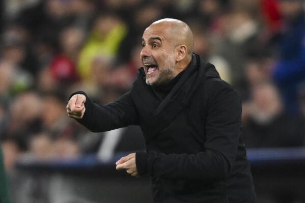 Manchester City's head coach Pep Guardiola gives instructions to his players during the Champions League quarter finals second leg soccer match between Bayern Munich and Manchester City, at the Allianz Arena stadium in Munich, Germany, Wednesday, April 19, 2023. (AP Photo/Andreas Schaad)
