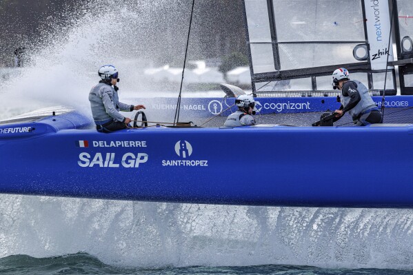 France SailGP Team helmed by Quentin Delapierre and Jason Saunders, flight controller of France SailGP Team and Olivier Herledant, grinder of France SailGP Team in action ahead of the ITM New Zealand Sail Grand Prix in Christchurch, New Zealand, Friday, March 22, 2024. (Felix Diemer/SailGP via AP)