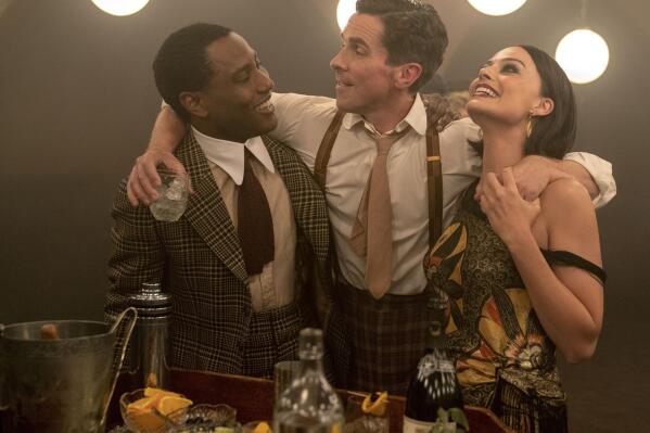This image released by 20th Century Studios shows, from left, John David Washington, Christian Bale and Margot Robbie in a scene from "Amsterdam." (Merie Weismiller Wallace/20th Century Studios via AP)