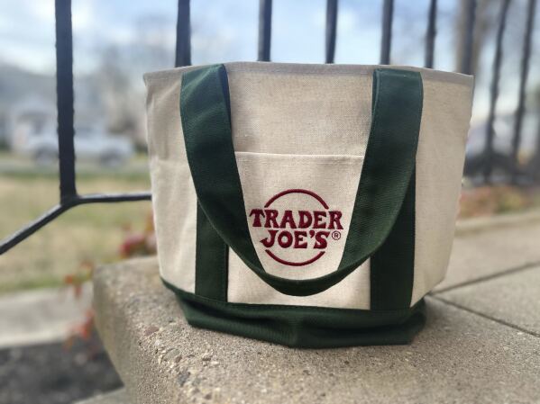 A Trader Joe's mini tote bag is shown in Palmyra, N.J., on Wednesday, March 13, 2024. The bag is the latest item to cause a stir on social media, so much so that resellers are taking advantage of the hype. (AP Photo/Christina Paciolla)