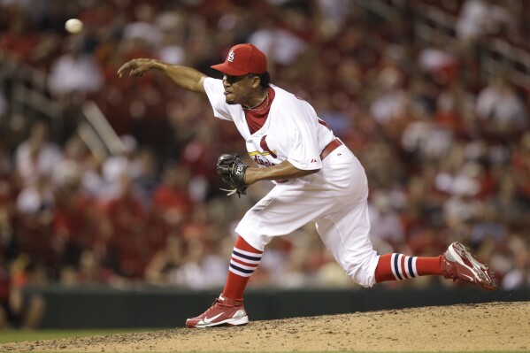 St. Louis Cardinals relief pitcher Octavio Dotel throws during the ninth inning of a baseball game against the Houston Astros Thursday, July 28, 2011, in St. Louis. (AP Photo/Jeff Roberson, File)