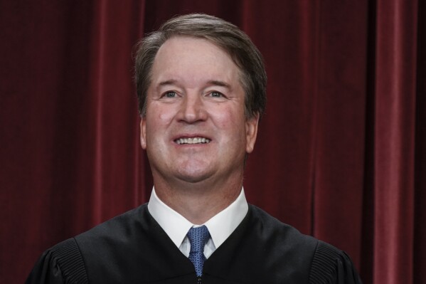 FILE - Supreme Court Justice Brett Kavanaugh poses for a new group portrait at the Supreme Court building in Washington, Oct. 7, 2022. Kavanaugh sought Thursday, July 13, 2023, to dispel notions of a partisan high court, stressing the collegial relationships among the justices that sometimes help them land on the same sides of issues despite their differences. Kavanaugh sought Thursday to dispel notions of a partisan high court, stressing the collegial relationships among the justices that sometimes help them land on the same sides of issues despite their differences. (AP Photo/J. Scott Applewhite, File)