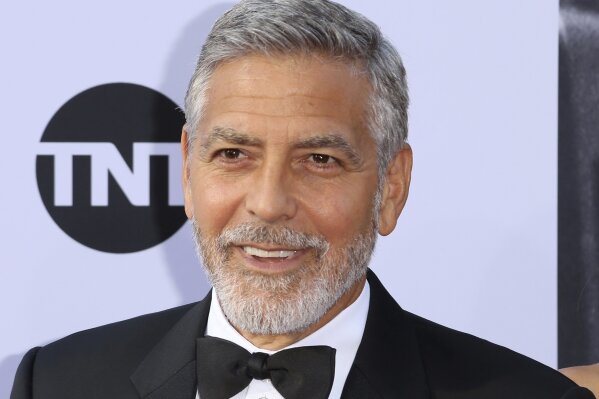 
              FILE - In this June 7, 2018, file photo, George Clooney arrives at the 46th AFI Life Achievement Award Honoring himself at the Dolby Theatre in Los Angeles. Clooney tops the 2018 Forbes' list of highest-paid actors with $239 million in pretax earnings. Forbes credits up to $1 billion that a British conglomerate said it would pay for Casamigos Tequila, which Clooney co-founded in 2013 with two entrepreneurs. (Photo by Willy Sanjuan/Invision/AP, File)
            