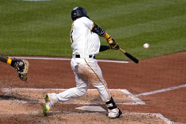 Pittsburgh Pirates' Michael Chavis, right, celebrates with Bryan Reynolds  (10) after hitting a two-run home run off Milwaukee Brewers starting  pitcher Aaron Ashby during the third inning of a baseball game in