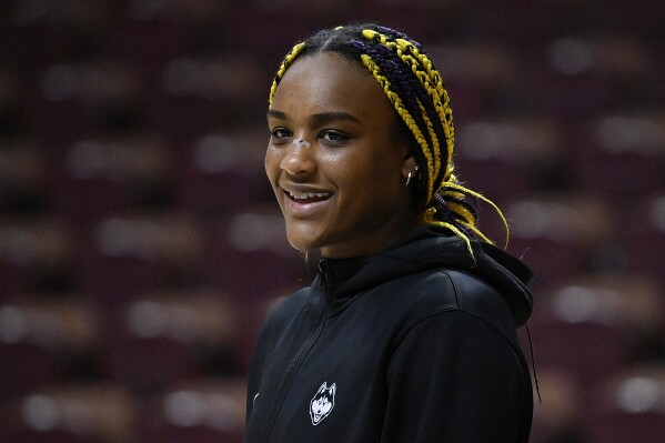 UConn forward Aaliyah Edwards (3) smiles as she watches her teammates warm up before an NCAA college basketball game in the semifinals of the Big East Conference tournament at Mohegan Sun Arena, Sunday, March 10, 2024, in Uncasville, Conn. (AP Photo/Jessica Hill)