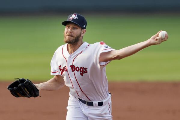 Boston Red Sox starting pitcher Chris Sale throws during the second inning of rehab start with the Portland Sea Dogs as he recovers from Tommy John surgery, during the team's minor league baseball game against the Harrisburg Senators, Tuesday, July 20, 2021, in Portland, Maine. (AP Photo/Mary Schwalm)