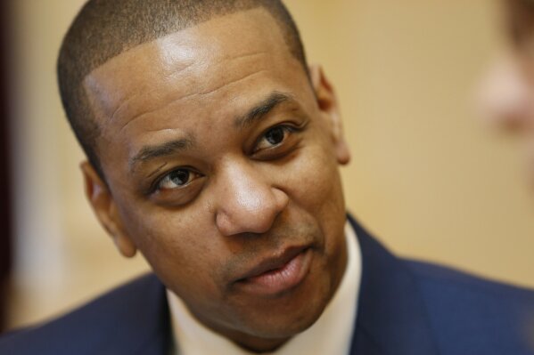 
              Virginia Lt. Gov. Justin Fairfax is prepped for the Senate session at the Capitol in Richmond, Va., Tuesday, Feb. 12, 2019. Vanessa Tyson, a college professor who has accused Fairfax of sexual assault, will appear Tuesday at a long-planned Stanford University academic symposium on that topic. (AP Photo/Steve Helber)
            