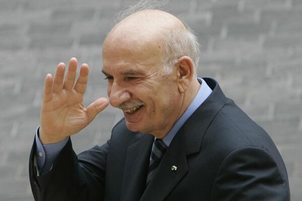 FILE - Legislator Hussein al-Husseini, a former parliament speaker waves his hand as he leaves the parliament building after he announced he was quitting his parliamentary seat to protest an Arab-brokered deal that produced a Cabinet of opposing factions, in Beirut, Lebanon, Tuesday, Aug. 12, 2008. Husseini died Wednesday, Jan. 11, 2023 after days of illness, he was the father of the 1989 Taif Agreement that ended the country's 15-year civil war. He was 85. (AP Photo/Hussein Malla, File)