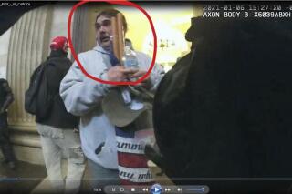 This image from police-worn body camera video shows Glenn Wes Lee Croy, that was circled in red in the statement of facts supporting the arrest warrant for Croy, in the U.S. Capitol on Jan. 6, 2021, in Washington. (FBI via AP)
