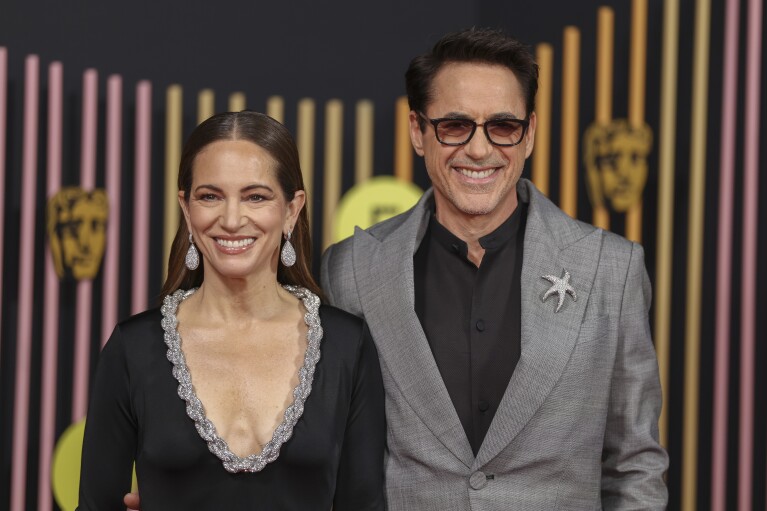 Susan Downey, left, and Robert Downey Jr. pose for photographers upon arrival at the 77th British Academy Film Awards, BAFTA's, in London, Sunday, Feb. 18, 2024. (Photo by Vianney Le Caer/Invision/AP)