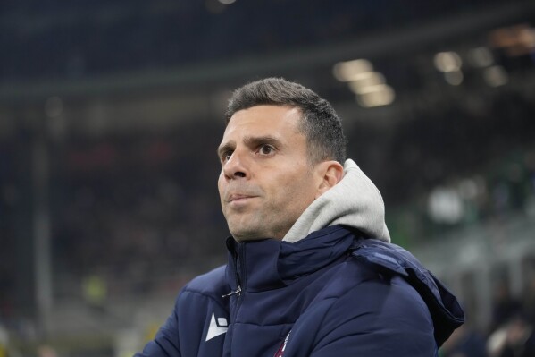 Bologna's head coach Thiago Motta waits for the start of an Italian Cup round of 16 soccer match between Inter Milan and Bologna, at the San Siro stadium in Milan, Italy, Wednesday, Dec. 20, 2023. (AP Photo/Luca Bruno)
