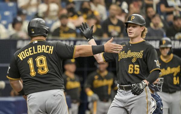 Pittsburgh Pirates' Daniel Vogelbach (19) congratulates Jack Suwinski (65) after his three-run home run off Tampa Bay Rays reliever Jake Beeks during the sixth inning of a baseball game Saturday, June 25, 2022, in St. Petersburg, Fla. (AP Photo/Steve Nesius)