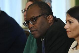 FILE - In this Friday, Sept. 17, 2021 file photo, Britain's Business Secretary Kwasi Kwarteng, centre, participates in the first Cabinet meeting since the reshuffle, at 10 Downing Street, in London, Friday, Sept. 17, 2021. Britain's business secretary will hold emergency talks with industry leaders and consumer groups as the government looks for ways to support energy companies threatened by soaring natural gas prices. Kwasi Kwarteng says that Britain’s energy regulator would ensure gas and electricity keeps flowing to customers if their energy supplier fails. (Ben Stansall/Pool Photo via AP, File)