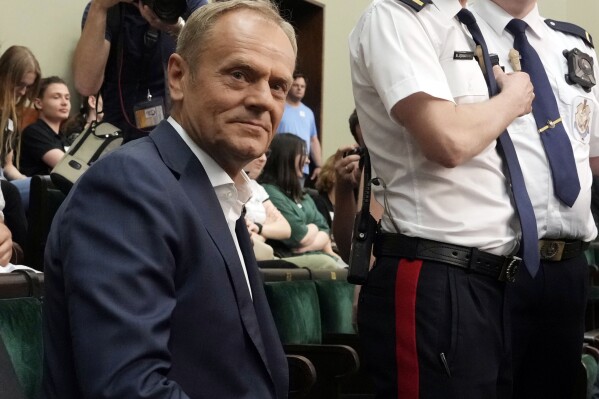 FILE - Poland's opposition leader and former prime minister, Donald Tusk, look on in parliament in Warsaw, Poland, on Friday, May 26, 2023. Poland's controversial commission for examining Russian influences in Poland, that is seen as targeting the opposition ahead of Oct.15 parliamentary elections will not be formed before that vote, a prominent member of the ruling party said Friday, Aug, 18. The commission is seen as intended to diminish the popularity of main opposition leader Donald Tusk ahead of the elections in which the ruling conservative party is seeking an unprecedented third term. (AP Photo/Czarek Sokolowski, File)