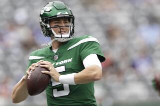 FILE - New York Jets quarterback Mike White (5) practices before a preseason NFL football game against the New York Giants, Sunday, Aug. 28, 2022, in East Rutherford, N.J. Zach Wilson has been benched by the New York Jets and will be replaced by Mike White as the starter Sunday against the Chicago Bears. Coach Robert Saleh announced the decision Wednesday, Nov. 23, after evaluating and discussing the situation with his assistants. (AP Photo/Adam Hunger, File)