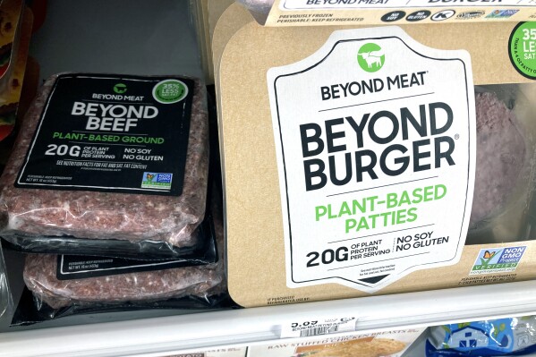 FILE - A selection of Beyond Meat products are displayed in a cooler at grocery store Monday, May 3, 2021, in Orlando, Fla. Beyond Meat is cutting 19% of its non-production workforce after a weaker-than-expected third quarter. The plant-based meat company said Thursday, Nov. 2, 2023, that the reduction of approximately 65 employees is part of a broader corporate review. (AP Photo/John Raoux, File)