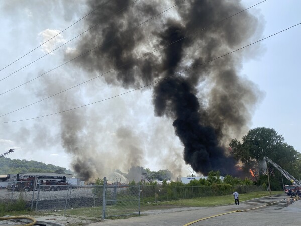 This photo provided by the Kansas City Fire Department shows a wood-pallet warehouse burning in the Northeast Industrial District in Kansas City, Mo., Thursday, June 15, 2023. (Jason Spreitzer/Kansas City Fire Department via AP)