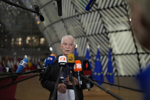 European Union foreign policy chief Josep Borrell speaks with the media as he arrives for a meeting of EU foreign ministers at the European Council building in Brussels, Monday, Dec. 11, 2023. Pressure mounted on Hungary on Monday not to veto the opening of European Union membership talks and the supply of economic aid to war-torn Ukraine at a pivotal EU summit this week, after Prime Minister Viktor Orban demanded that the issue be struck from the agenda. (AP Photo/Virginia Mayo)