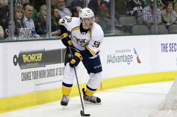 Nashville Predators' Roman Josi, of Switzerland, controls the puck during the first period of an NHL hockey game against the Dallas Stars, March 28, 2014, in Dallas. (AP Photo/Tony Gutierrez, File)