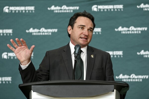 New Michigan State football coach Jonathan Smith speaks during an introductory NCAA college football press conference Tuesday, Nov. 28, 2023, in East Lansing, Mich. (Jake May/The Flint Journal via AP)