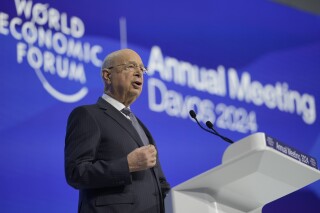 Klaus Schwab, Chairman of the World Economic Forum addresses attendees during the opening of the Annual Meeting of World Economic Forum in Davos, Switzerland, Tuesday, Jan. 16, 2024. Social media users are misrepresenting a speech Schwab gave in 2017 to falsely claim he admitted a "political revolution" is destroying his agenda. (AP Photo/Markus Schreiber)