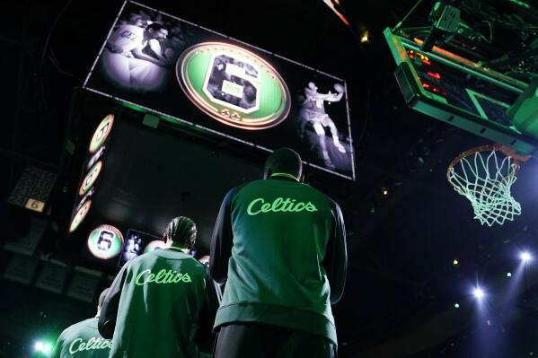 Hall of Famer and former Boston Celtics great Bill Russell is honored prior to an NBA basketball game between the Boston Celtics and Philadelphia 76ers, Tuesday, Oct. 18, 2022, in Boston. Russell died in July. (AP Photo/Charles Krupa)